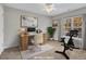 Functional home office setup featuring a spacious desk and exercise equipment at 706 Canyon Lake Cir, Morrisville, NC 27560