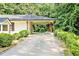 A side view of the carport attached to the single-story home at 7414 Virgilina Rd, Roxboro, NC 27574