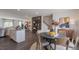 Open-concept design: dining area flows to the kitchen, complemented by stylish furnishings and decor at 813 Washington St, Fuquay Varina, NC 27526