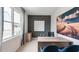 Bright home office with a modern desk, large window, and stylish decor at 813 Washington St, Fuquay Varina, NC 27526