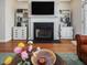 Stylish living room featuring a fireplace, and hardwood floors at 916 Highgrove Dr, Chapel Hill, NC 27516