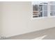 Bright bedroom with light walls, carpet, a white framed window, and an electrical outlet at 94 Paper Birch Way, Fuquay Varina, NC 27526