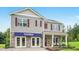Charming new two-story home with stone accents, gray siding, burgundy shutters, and a covered porch at 94 Paper Birch Way, Fuquay Varina, NC 27526