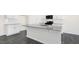 Well-appointed kitchen with granite countertops, stainless appliances, and white cabinetry at 94 Paper Birch Way, Fuquay Varina, NC 27526