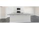Bright kitchen boasts a large island, stainless steel appliances, and modern fixtures at 94 Paper Birch Way, Fuquay Varina, NC 27526
