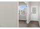 Welcoming entryway featuring wood-look floors, white door, sidelight and a view of the outdoors at 99 Paper Birch Way, Fuquay Varina, NC 27526