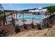 Community pool with lounge chairs and umbrellas for relaxing summer days at 99 Paper Birch Way, Fuquay Varina, NC 27526