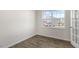 Inviting room with natural light, wood-look floors, neutral paint, and exterior views through the window at 99 Paper Birch Way, Fuquay Varina, NC 27526
