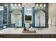 Elegant bathroom featuring dual sinks with brass faucets, a marble countertop, and blue tile backsplash at 0 High Rock Rd, Efland, NC 27243