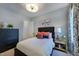 Charming bedroom with dark wood furniture, soft lighting, and decorative pillows at 0 High Rock Rd, Efland, NC 27243