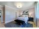 A stylish bedroom with light pink walls, modern furnishings, and a comfortable striped bed at 0 High Rock Rd, Efland, NC 27243