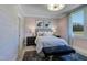 A stylish bedroom with pink walls, modern furnishings, and a comfortable striped bed at 0 High Rock Rd, Efland, NC 27243
