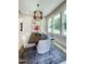 Beautiful dining room featuring a modern chandelier, a dark wood table with seating for six, and views of the outdoors at 0 High Rock Rd, Efland, NC 27243