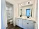 Bathroom featuring double sink vanity with modern fixtures and a separate toilet and shower room at 1020 Channel Drop Lp, Zebulon, NC 27597