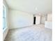 Spacious bedroom with neutral carpet, large window and plenty of natural light at 1020 Channel Drop Lp, Zebulon, NC 27597