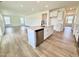 Spacious kitchen with large island, quartz countertop, stainless steel dishwasher, and modern sink at 1020 Channel Drop Lp, Zebulon, NC 27597