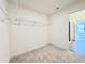 Spacious walk-in closet with wire shelving and carpeted floor offering practical storage solutions at 1020 Channel Drop Lp, Zebulon, NC 27597