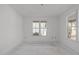 Bright bedroom with a window and view of the exterior of the house at 104 Pointe Park Cir, Holly Springs, NC 27540