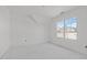 Bright bedroom featuring two large windows providing ample natural light at 104 Pointe Park Cir, Holly Springs, NC 27540
