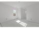 Cozy bedroom with natural light streaming through a window, blank canvas for personalization at 104 Pointe Park Cir, Holly Springs, NC 27540