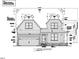 Detailed front elevation of a two-story home with dormers and a two-car garage, showcasing the architectural design at 104 Pointe Park Cir, Holly Springs, NC 27540