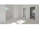 Hallway under construction features a window and door access to various areas of the home at 104 Pointe Park Cir, Holly Springs, NC 27540