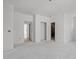 Bright, open living room featuring a fresh, minimalist design and multiple entryways at 104 Pointe Park Cir, Holly Springs, NC 27540