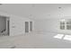 Bright, spacious living room featuring high ceilings and large windows offering ample natural light at 104 Pointe Park Cir, Holly Springs, NC 27540