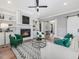 Cozy living room with fireplace, built-in bookshelves, and plush seating at 104 Pointe Park Cir, Holly Springs, NC 27540
