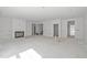 Spacious living room offering multiple doorways for easy access to other areas of the house at 104 Pointe Park Cir, Holly Springs, NC 27540