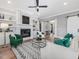 Cozy living room with fireplace, built-in bookshelves, and plush seating at 104 Pointe Park Cir, Holly Springs, NC 27540