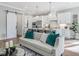 Bright, stylish living room featuring an open layout, modern decor, and natural light at 104 Pointe Park Cir, Holly Springs, NC 27540