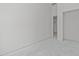 Bright, open living room featuring a fresh, minimalist design with ample natural light at 104 Pointe Park Cir, Holly Springs, NC 27540