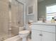 Neat bathroom features a white vanity with drawers, a toilet, and a walk-in shower with glass door at 107 Marseille Pl, Cary, NC 27511