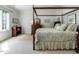 Tranquil bedroom features natural light, four-poster bed, and neutral tones at 107 Marseille Pl, Cary, NC 27511