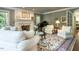 Comfortable living room with fireplace, piano, and neutral decor at 107 Marseille Pl, Cary, NC 27511