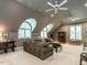 Spacious living room with comfortable furniture, and unique arch top windows at 107 Marseille Pl, Cary, NC 27511