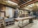 This workshop space offers ample storage and workspaces, illuminated by bright overhead lighting at 107 Marseille Pl, Cary, NC 27511