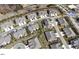 Enjoy community amenities in this neighborhood with an aerial view of townhomes and a pool and clubhouse in the background at 1126 Talisker Way, Burlington, NC 27215