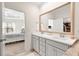 Bathroom featuring a double sink vanity, and doorway to the bedroom at 1126 Talisker Way, Burlington, NC 27215