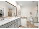 Bathroom features a double sink vanity, and a separate toilet room with tiled shower at 1126 Talisker Way, Burlington, NC 27215