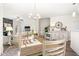 Open floorplan showing dining room with chandelier open to the living room and fireplace at 1126 Talisker Way, Burlington, NC 27215