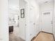 Bright entryway with white walls, a stylish rug, and a glimpse into a sunlit living space at 1126 Talisker Way, Burlington, NC 27215