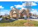 This beautiful home features a brick exterior, a two-car garage and a well-maintained lawn at 1126 Talisker Way, Burlington, NC 27215