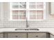 Bright kitchen featuring a double sink with modern faucet and a window with natural light at 1126 Talisker Way, Burlington, NC 27215