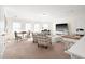 Spacious living room with natural light, a large TV, and comfortable seating at 1126 Talisker Way, Burlington, NC 27215