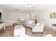 Bright living area with neutral tones, comfortable seating, and a functional desk at 1126 Talisker Way, Burlington, NC 27215