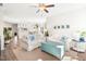 Bright living room featuring white sofas, light wood floors, and open floor plan at 1126 Talisker Way, Burlington, NC 27215