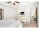 Spacious bedroom with TV, dresser, and entryways to bathroom and living room at 1126 Talisker Way, Burlington, NC 27215