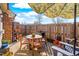 Inviting patio space featuring a charming dining set and a well-maintained wooden fence at 1126 Talisker Way, Burlington, NC 27215